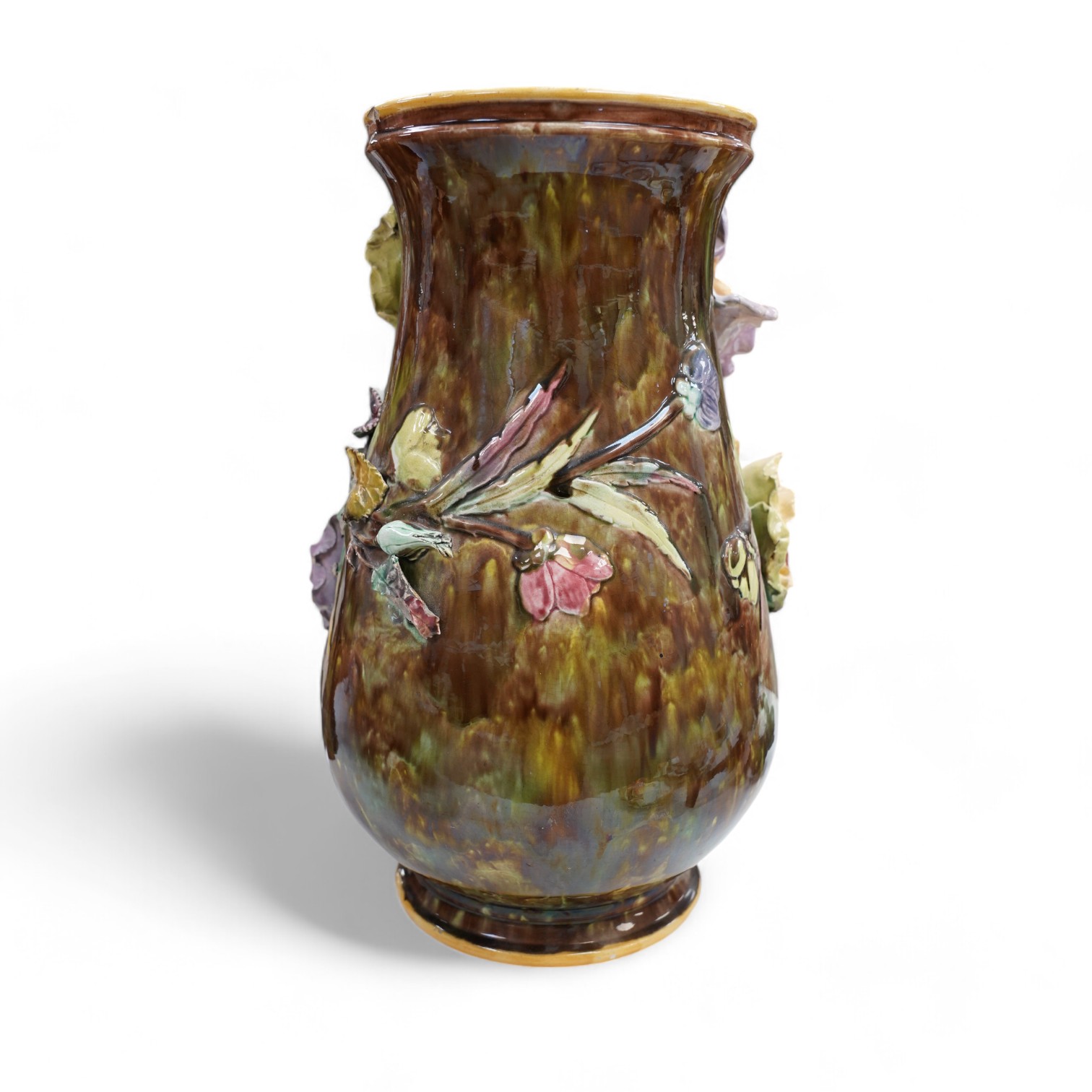 A large majolica floral decorated vase, 39cm. Condition - fair, several chips